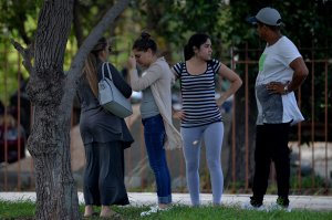 Relatives of the victims of the plane that crashed shortly after taking off from Jose Marti International Airport, killing 107 people, stand outside the Institute of Legal Medicine in Havana, on May 19, 2018. (Credit: YAMIL LAGE/AFP/Getty Images)
