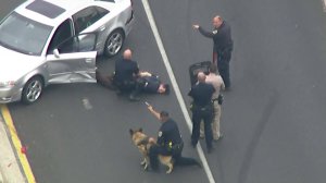 A man who led authorities on a wild pursuit through several Southern California highways is taken into custody on May 1, 2018. (Credit: KTLA)
