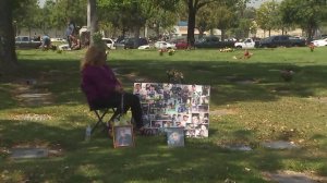 Jessie Lopez sits by her son's gravesite on May 10, 2018. (Credit: KTLA)