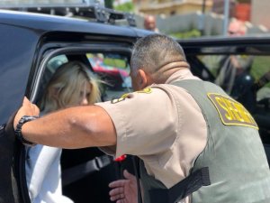 Dariia Kostenko is seen with a deputy in an image provided by the Los Angeles County Sheriff's Department on May 31, 2018.