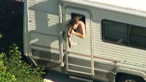 A man suspected of burglary is seen inside a motor home on May 7, 2018. (Credit: KTLA)