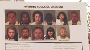 The mugshots of 11 of the suspects were displayed at a news conference in Riverside on May 29, 2018. (Credit: KTLA)