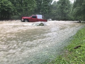 A truck is seen surrounded by floodwaters in North Carolina in May 2018 as subtropical depression Alberto wreaked havoc on the southeastern U.S. (Credit: Nathan West/Twitter via CNN)