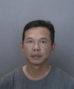Kelven Ta, 47, is seen in a booking photo released May 3, 2018, by the Anaheim Police Department.