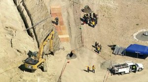 Authorities respond to a construction site in Lake Forest where a worker was believed trapped in a collapsed trench on May 9, 2018. (Credit: KTLA)