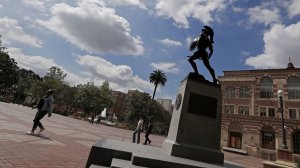 In a file photo, the statue of Tommy Trojan looks up at cloudy skies from his pedestal in the middle of the USC campus. (Credit: Luis Sinco / Los Angeles Times)