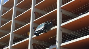 A car was dangling from a Santa Monica parking structure on June 11, 2018. (Courtesy Merle Stadnyk)