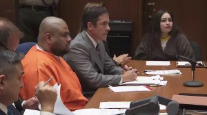 Isauro Aguirre, left, and Pearl Fernandez, right, flanked by attorneys, are shown at a sentencing hearing on June 7, 2018. (Credit: KTLA)