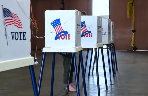 A woman casts her vote at a polling station inside the Alhambra Fire Department in Alhambra on June 5, 2018. (Credit: FREDERIC J. BROWN/AFP/Getty Images)
