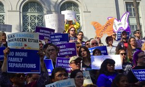 People gather on the steps of City Hall in Los Angeles on June 7, 2018 to protest immigration policies that result in the separation of children and their parents. (Credit: FREDERIC J. BROWN/AFP/Getty Images)