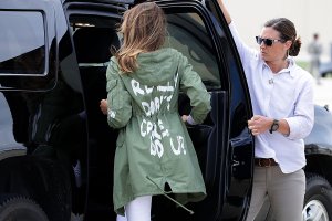 U.S. first lady Melania Trump, center, climbs back into her motorcade after traveling to Texas to visit facilities that house and care for children taken from their parents at the U.S.-Mexico border June 21, 2018, at Joint Base Andrews, Maryland. (Credit: Chip Somodevilla/Getty Images)