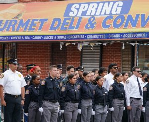 Members of the NYPD Junior League wait for the arrival the body of Lesandro "Junior" Guzman-Feliz during a funeral on June 27, 2018, in New York. (Credit: Don Emmert / AFP / Getty Images)