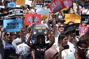 Protesters march from Freedom Plaza to demonstrate against family detentions and to demand the end of criminalization of asylum seekers on June 28, 2018, in Washington, DC. (Credit: Win McNamee / Getty Images)