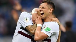 Javier Hernandez and Miguel Layun of Mexico celebrate their team’s victory in the World Cup match against South Korea on June 23, 2018, in Russia. (Credit: Hector Vivas/Getty Images)