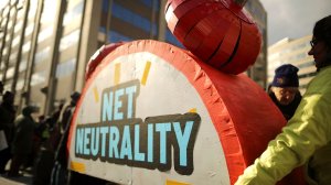 Rally organizers carry away props following a protest outside the Federal Communication Commission building in Washington, D.C., against the end of net neutrality rules on Dec. 14, 2017. (Credit: Chip Somodevilla/Getty Images)