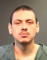 Carlos Alexander Gonzalez, 20, is seen in an undated booking photo. (Credit: Santa Ana Police Department)