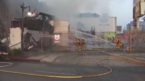Firefighters battle a fire at a strip mall in East Hollywood on June 3, 2018. (Credit: KTLA)
