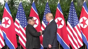President Donald Trump and North Korean leader Kim Jong Un shake hands ahead of a summit in Singapore on June 11, 2018. (Credit: CNN)