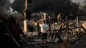 Eric Durtschi surveys the charred remains of his rental home in Goleta on July 7, 2018. (Credit: Marcus Yam/Los Angeles Times)