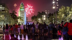 People gather downtown to watch L.A.'s official, and legal, fireworks show at City Hall. (Credit: Los Angeles Times)