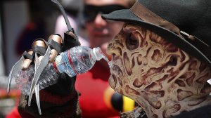 Stefano Alippi, dressed up as Freddy Krueger, cools off on Hollywood Boulevard during a heat wave in July 2018. (Credit: Mel Melcon / Los Angeles Times)