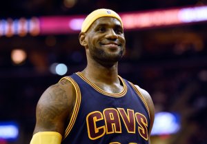 LeBron James of the Cleveland Cavaliers smiles after a play in the second quarter against the New York Knicks at Quicken Loans Arena on October 30, 2014 in Cleveland, Ohio. (Credit: Jason Miller/Getty Images)