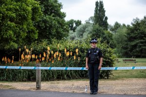 A police officer stands at a cordon at Queen Elizabeth Gardens in Salisbury, England, thought to be connected to a man and woman in nearby Amesbury who are in hospital after being exposed to an unknown substance on July 4, 2018. (Credit: Jack Taylor / Getty Images)