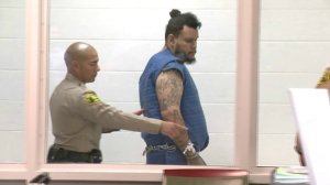 Kareem Ernesto Leiva is escorted into an Antelope Valley courtroom on July 2, 2018. (Credit: KTLA)