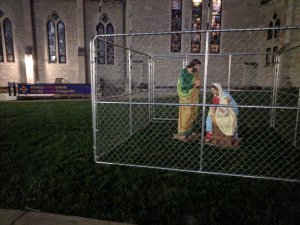 A church in Indianapolis has put up a display that shows the statues of Mary, Joseph and Baby Jesus in a cage to protest the Trump administration's 'zero tolerance' policy. (Credit: Christ Church Cathedral via CNN)