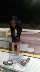 A video posted on BillionGODSun's YouTube page on Aug. 1, 2018 shows a man dragging an unresponsive man off a Blue Line train in Long Beach. 