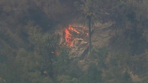 The charred remnants of what appears to be a structure can be seen in this aerial Sky5 footage of the Holy Fire, which started in the Trabuco Canyon area on Aug. 6, 2018. (Credit: KTLA)