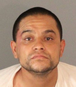 Leonard Martinez, 32, is seen in a booking photo released by Riverside police on Aug. 17, 2018.