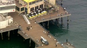 Santa Monica Police Department officials respond to a shooting at the pier on Aug. 23, 2018. (Credit: KTLA)