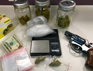 Confiscated marijuana, methamphetamine and a gun are displayed on Aug. 26, 2018. (Credit: Long Beach Police Department)