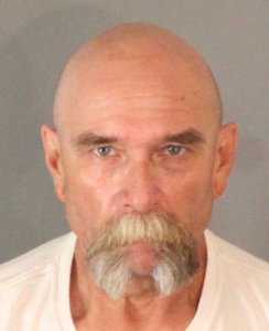 John Titow, 59, is seen in a booking photo released by Riverside police on Aug. 17, 2018.