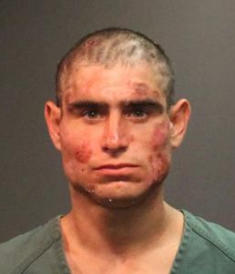 Alan Alberto Flores, 28, is pictured in a Santa Ana Police Department booking photo following his arrest on Sept. 3, 2018.