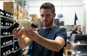 Cody Wilson, owner of Defense Distributed, holds a 3-D-printed gun called the Liberator in his Austin, Texas, factory on Aug. 1, 2018. (Credit: Kelly West / AFP / Getty Images)