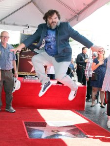 Jack Black jumps in front of his newly-minted star on the Hollywood Walk of Fame on Sept. 18, 2018. (Credit: David Livingston/Getty Images)