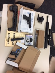 Guns and other materials that authorities say were used to illegally manufacture firearms at a home in Oxnard are seen in this photo released by the Ventura County Sheriff's Office on Sept. 20, 2018.