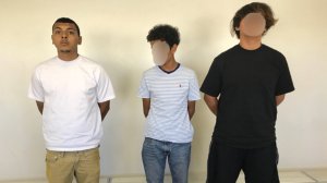 Richard Navarrete is seen alongside the two juvenile suspects in a photo released by the San Bernardino County Sheriff's Department.