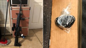 A modified assault rifle and black tar heroin seized by Los Angeles County sheriff's deputies in East L.A. are seen in images released Sept. 25, 2018, by the Sheriff's Department.