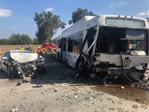 A bus and a sedan sit on the 405 Freeway in the North Hills area following a crash on Oct. 14, 2018. (Credit: Los Angeles Fire Department)