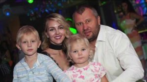 Yana Lavrenteva is surrounded by her husband and their two children in this undated photo provided by the family.