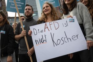 Demonstrators hold a poster reading "AfD is not kosher" as they take part in a rally organized by Germany's JSUD, or Jewish students' union, on Oct. 7, 2018, in Frankfurt am Main, western Germany. (Credit: FRANK RUMPENHORST/AFP/Getty Images)