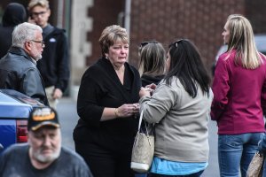 Mourners grieve after leaving a service at St. Stanislaus Roman Catholic Church for some of the victims in last weekend's fatal limo crash on Oct. 12, 2018, in Amsterdam, New York. (Credit: Stephanie Keith/Getty Images)