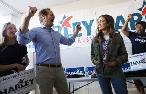 Actress Jessica Alba joins Democratic congressional candidate Harley Rouda as he greets supporters at a campaign canvass launch on Oct. 20, 2018, in Costa Mesa. (Credit: Mario Tama / Getty Images)