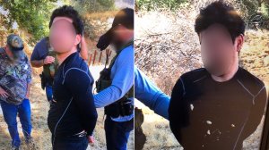 A burglary suspect is seen being taken into custody in a remote area of Malibu Creek State Park on Oct. 10, 2018, in images released by the Los Angeles County Sheriff's Department.