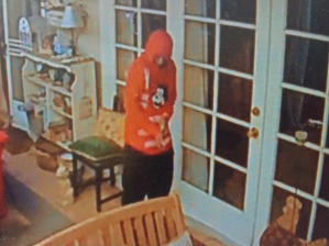 A burglary suspect is seen in an Encino home in a still from surveillance video released by Los Angeles police on Oct. 19, 2018.