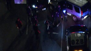 The suspect in a police pursuit in North Hollywood on Oct. 1, 2018, is seen surrendering to LAPD. (Credit: KTLA)