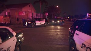 Authorities investigate the scene of an officer-involved shooting in the 5900 block of Loveland Street in Bell Gardens on Nov. 21, 2018.